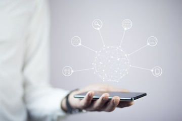 Hands holding phone with circle global network connection