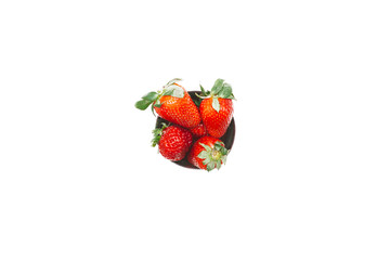 Fresh strawberry in a bowl on a white background, isolated top view. Summer health concept