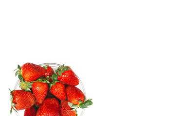 Fresh strawberry in a bowl on a white background, isolated top view. Copy space for text. Summer health concept
