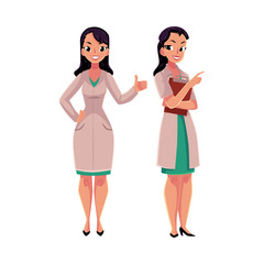 Obraz premium Two female, woman doctors in white medical coats, one showing thumb up, another holding clipboard, cartoon vector illustration isolated on white background. Full length portrait of two female doctors