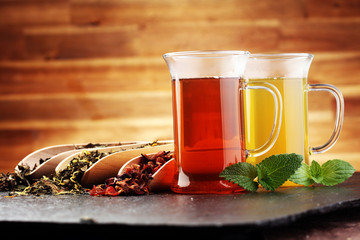 Tea. Herbal tea. Mint leaf. Tea in a glass cup, mint leaves, dried, sliced lime. herbs on a slate plate in a restaurant or teahouse