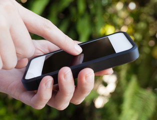 Hand typing on smartphone. 