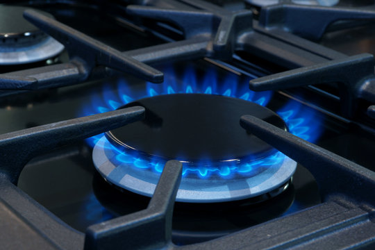 Gas cooker flames on a domestic stove or hob