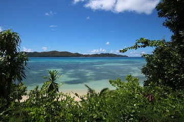 Fototapeta na wymiar View to Anse Petite Cour and Curieuse Island which are situated in the north of Praslin Island, Seychelles, Indian Ocean, Africa