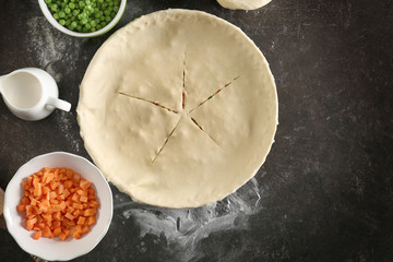 Unbaked chicken pot pie on kitchen table