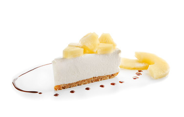Delicious cheesecake slice with pineapples on white background
