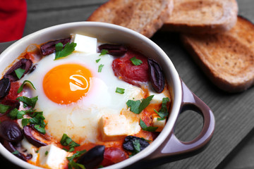 Baked egg in pot, closeup