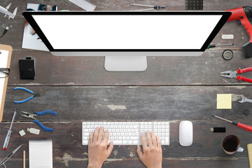 System installation. Configuring new hardware, installing and updating software. Isolated display for mockup. Top view of desk with free space for text. © Stanisic Vladimir