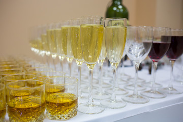 wine glasses with champagne and whiskey