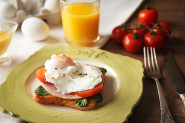 Tasty egg Benedict on plate