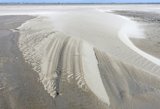 dessin du vent dans le sable