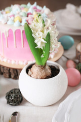 Obraz na płótnie Canvas Little pot with hyacinth flowers on Easter table