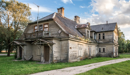 Fototapeta na wymiar Deteriorated abandoned haunted old house. Dobele, Latvia