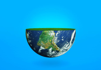 Half of the planet Earth with grass on a blue background. The concept of the ecology of the planet