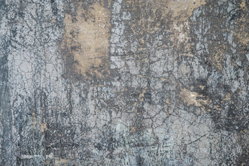 Obraz na płótnie Canvas Cracking and peeling paint on a wall