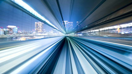 Fototapeta na wymiar rail track and cityscape of tokyo from speed train