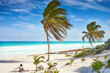 Untouched paradise under marvelous coconut trees / Tropical beach of Tulum in Mexico
