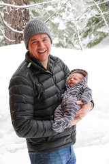 People: Father with newborn in snow