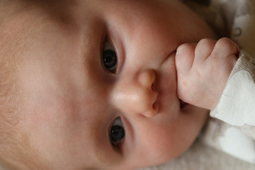 People: Baby sucking fingers