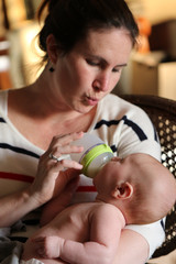 People: Mom feeding baby