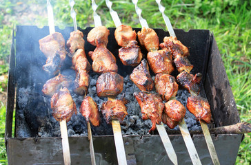 Delicious red meat on the grill during the preparation of shish kebab