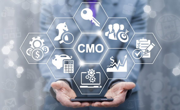 CMO - Chief Marketing Officer business shopping web store concept. Leadership internet shop mobile tech, finance, strategy office work. Businessman keep smart phone with cmo icon on virtual screen