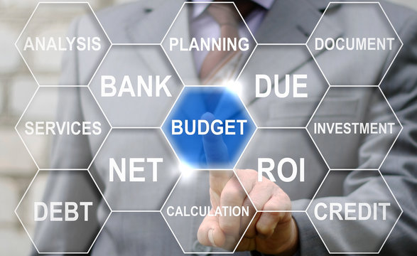 Businessman Touched Budget Word On Virtual Tag Cloud Screen. Budgeting And Calculation Finance Strategic Concept. Financial Office Strategy. Banking Capital Economy Investment Safety Money Technology.