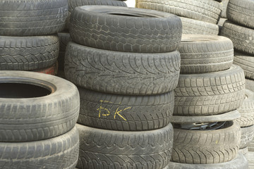 Pile of tires and wheels for rubber. Closeup for design work