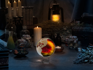 Mystical still-life. Magic ball, dry herbs, all for magical rituals. A lot of items