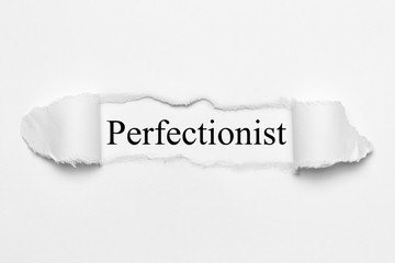 Perfectionist on white torn paper