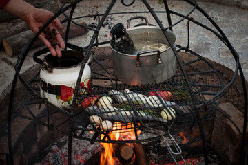preparation of soup and fish at the stake