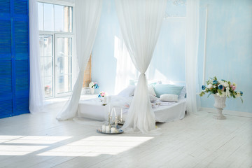 Interior white bedroom with canopy