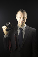 Naklejka premium Photographer in studio in suit