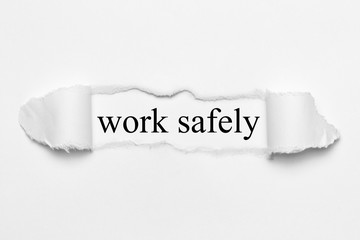 work safely on white torn paper