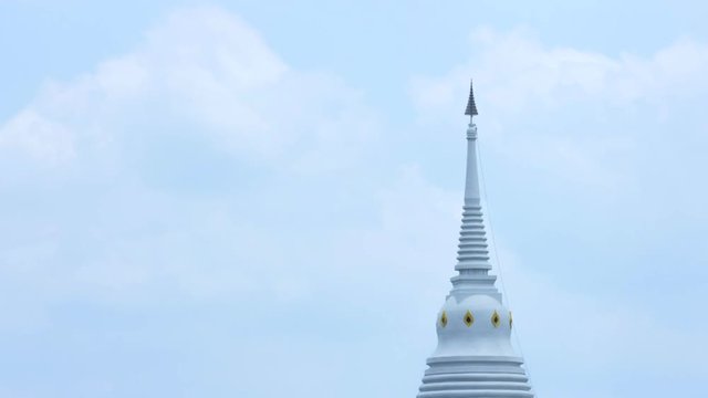 time lapse of white pagoda in temple on sky and cloud 