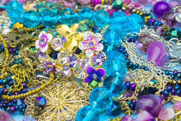 Top view, Vintage beads and jewelry on the old wooden table. Selective soft focus