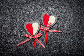 Two tissue hearts on sticks. Concept of romantic love