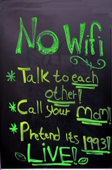 A board in front of the foodmarket  is announcing that there is No WiFi and suggests to talk to each other or call your mom or pretend it&rsquo;s 1993 or LIVE
