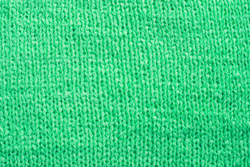 Green knitted pattern in the background