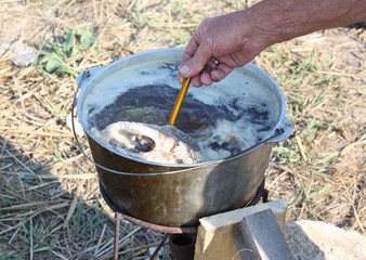 Cooking soup on a fishing trip