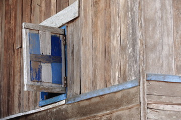 Obraz na płótnie Canvas Window on wooden wall-Lu tribe. SopChem village-Luang Prabang province-Laos. 3962