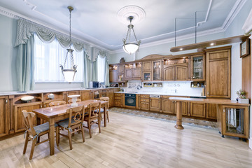 The kitchen is solid wood in a classic style in a modern house.
