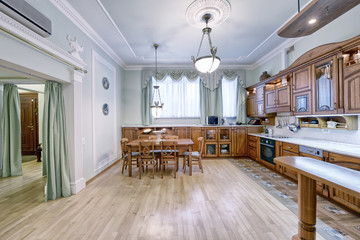 The kitchen is solid wood in a classic style in a modern house.