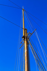 Fototapeta premium Yacht mast against blue summer sky