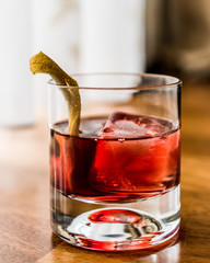 Negroni Cocktail with lemon peel and ice
