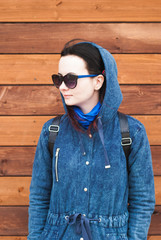 Girl in a blue jacket with a hood,