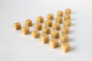 cane-sugar in cubes isolated on white