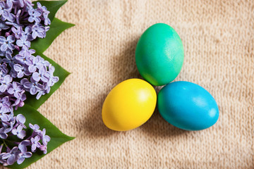 Obraz na płótnie Canvas Colored eggs on old style background with flowers, Easter concept