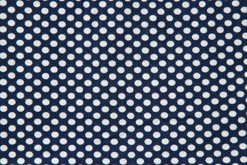 Textile white cirlces on dark background