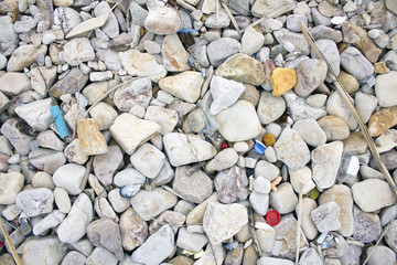 Polluted beach. Discarded plastic bottles and wastes on a beach